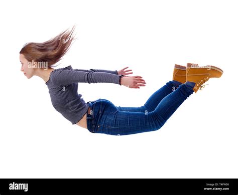 Side view of woman in zero gravity or a fall. girl is flying, falling ...