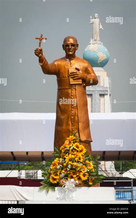 A golden statue of martyred Archbishop Oscar Romero across from the ...