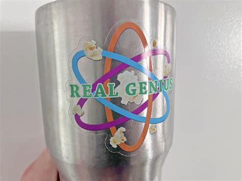 Real Genius Popcorn Atom - 3 in. tall Clear Vinyl Sticker - Pieces of Flair OG Store