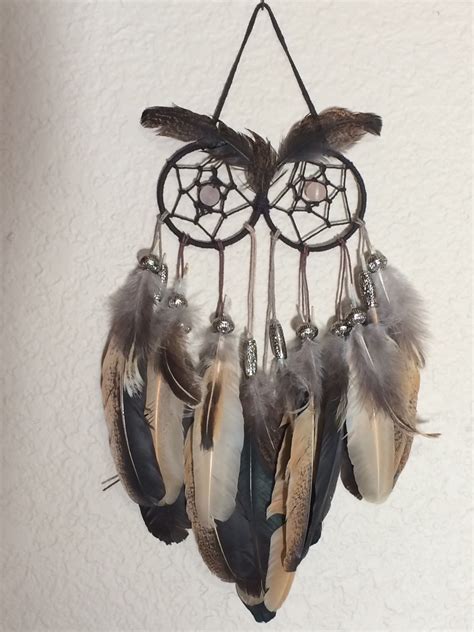 Used our own chicken feathers to make this. View on cream colored wall [chicken feather, owl ...