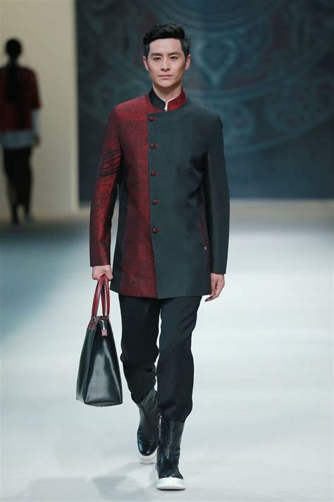 Models present creations from designer Zeng Fengfei at China's Fashion Week in Beijing ...