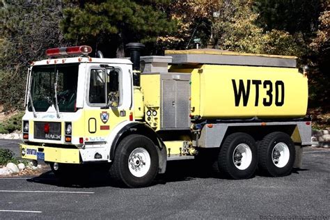 Bright Yellow Fire Truck in Parking Lot