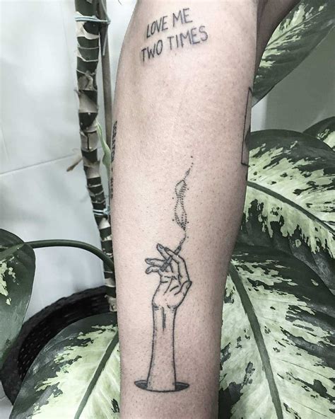 Arm and a cigarette tattoo - Tattoogrid.net