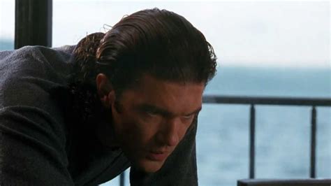 Antonio Banderas hairstyle with slicked back hair in Assassins