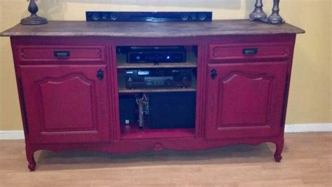 This is the after photo of my antique buffet repurposed as an entertainment center. Love it ...