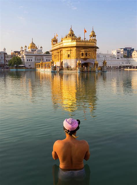 Sikh Praying At Golden Temple Amritsar Photograph by Adrian Pope