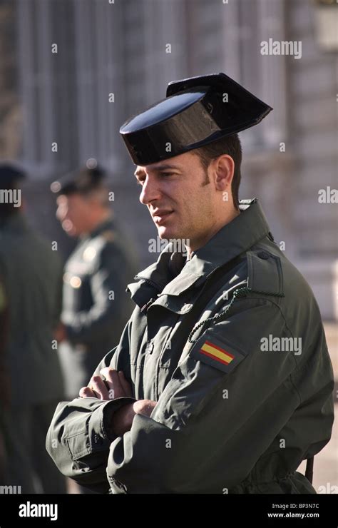 One of the Guardia Civil watching the tourists gathered to see the Changing of the Guard at The ...