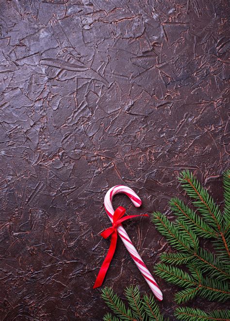 Premium Photo | Peppermint candy cane. Christmas festive background