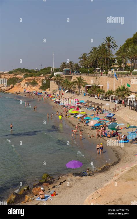 Punta Prima Orihuela Costa Costa Blanca Alicante province Spain with tourists on the beach in ...