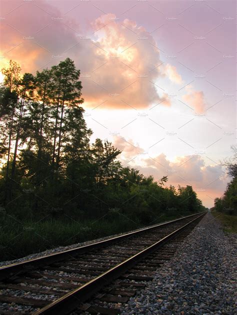 Railroad train tracks at sunset | Transportation Stock Photos ~ Creative Market