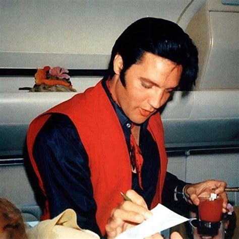 Elvis and Priscilla Presley fly on a plane from Hawaii to Los Angeles ...