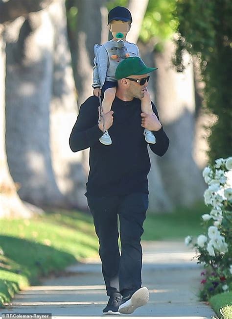 Jason Statham, 52, treats his son Jack, 2, to a piggyback ride during ...