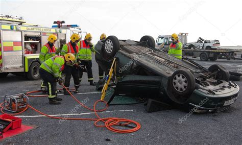 Fire and Rescue service staff at car crash training – Stock Editorial Photo © rihardzz #8200250