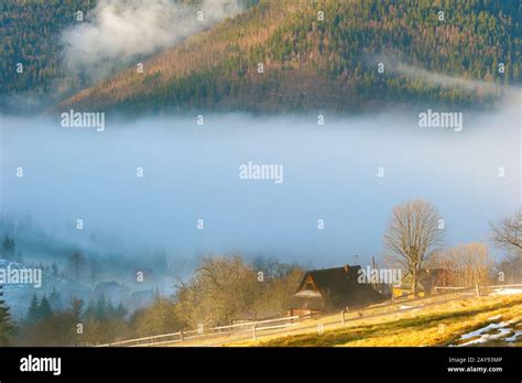 Mountain landscape with wooden hut Stock Photo - Alamy