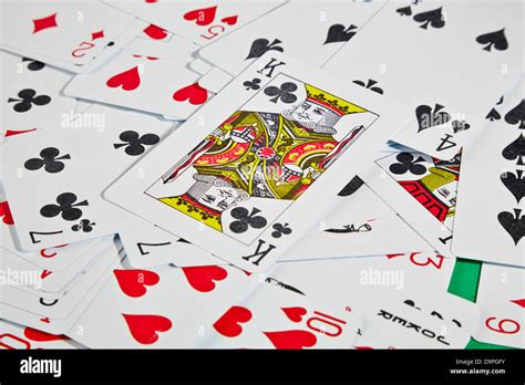 King card on top of other playing cards on table Stock Photo - Alamy