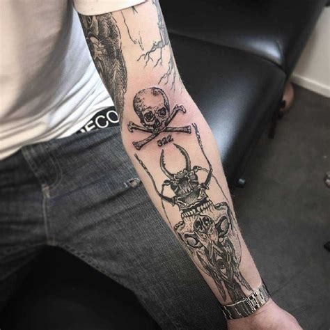 Skull and crossed bones tattoo on the left forearm | Forearm tattoos ...