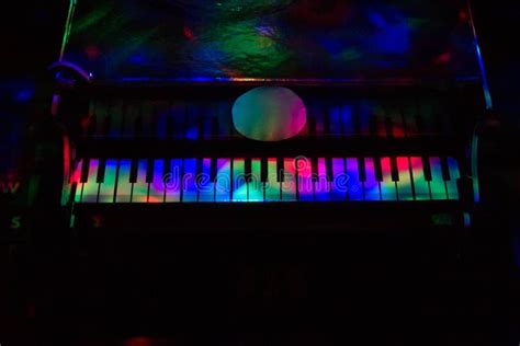 Piano on a Dark Background in the Light of Lamps. Close-up. Background ...