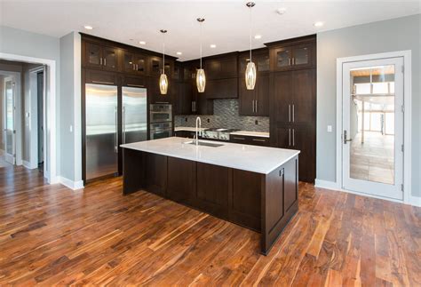 Espresso Kitchen Cabinets With Black Appliances And White Trim ...