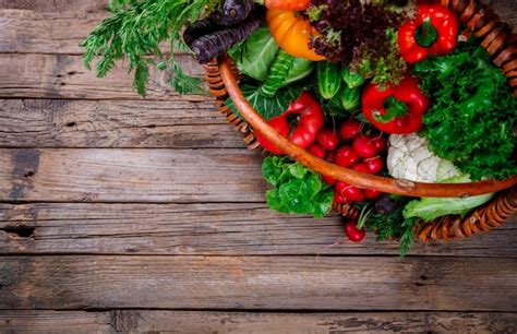 Premium Photo | Big basket with different fresh farm vegetables.