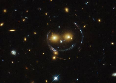 Hubble Sees A Smiling Gravitational Lens - SpaceRef