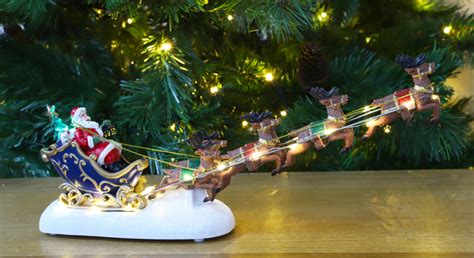 Christmas Concepts® 34cm Battery Operated LED Light Up - Santas Sleigh & Flying Reindeer Scene ...