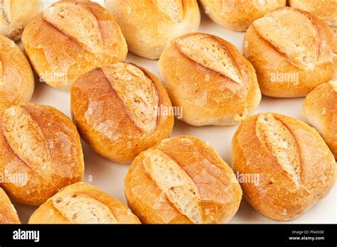 Plenty of fresh german bread rolls on white background in a german ...