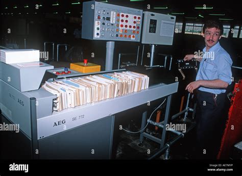 Post office worker controlling AEG OCR letter scanner postal sorting Stock Photo, Royalty Free ...