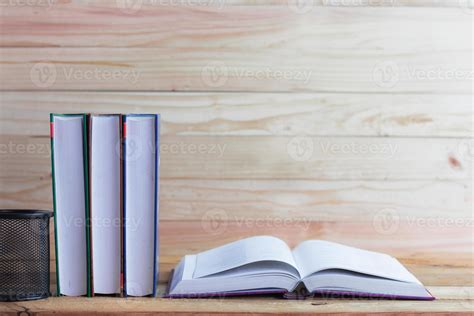 Books on desk and wood background 1976298 Stock Photo at Vecteezy