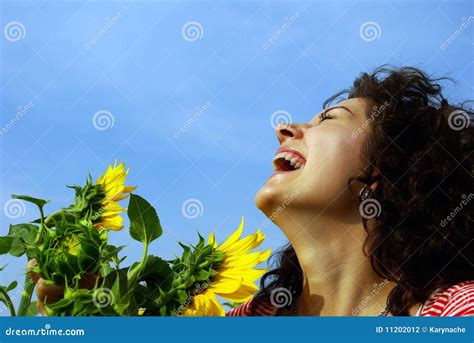 Laughing Pretty Girl with a Sunflower Stock Photo - Image of beautiful, carefree: 11202012