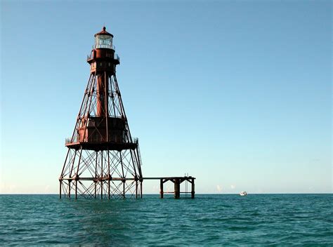 Lighthouse on Ocean · Free Stock Photo