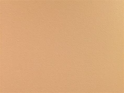 Subtle paint texture on a flat tan wall | Free Textures