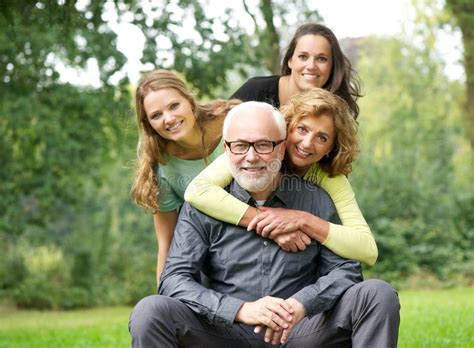 Happy Family Laughing Together Outdoors Stock Photo - Image: 33967030