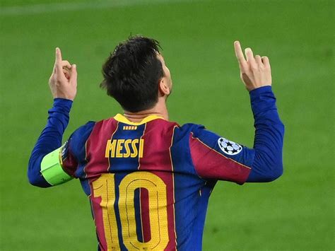 Download Messi 2021 Pointing Upwards Wallpaper | Wallpapers.com