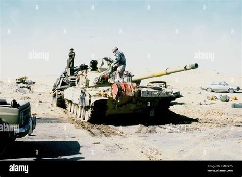 American servicemen check over an Iraqi T-72 main battle tank that was ...