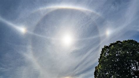 Ethereal 'halo' and light arcs around the sun captured in photos of ...