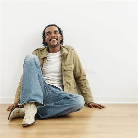 Man sitting on floor stock photo. Image of african, male - 4416700