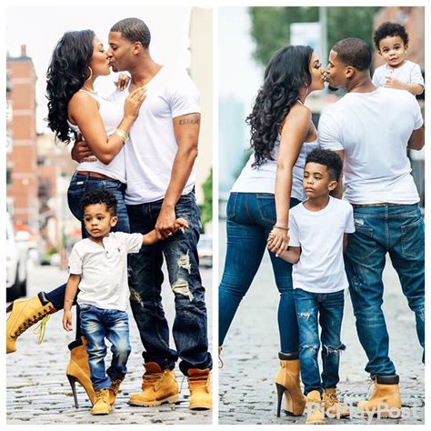 the family is posing for pictures together on the cobblestone street in ...