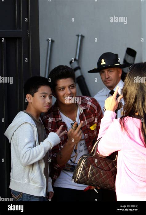 Bruno Mars meets fans after performing at The Grove Los Angeles ...