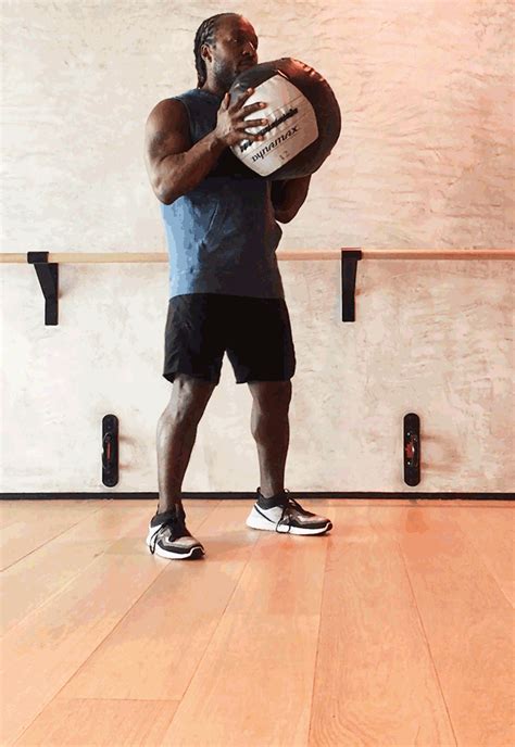 6 Slam Ball Exercises for Stronger Legs and Glutes: Squat With Front Push Exercise Slamball ...