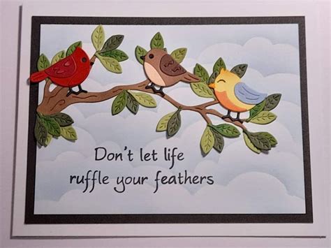 a card with two birds sitting on a branch and the words don't let life ruffle your feathers