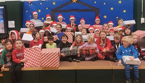 Farnham Primary School pupils deliver presents to Holy Trinity Winter Night Shelter in Bishop’s ...