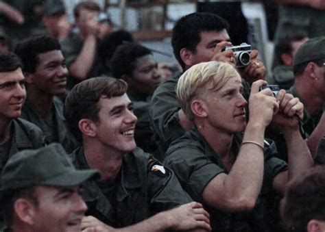 Members of the 101st Airborne Division take photographs during the Bob ...