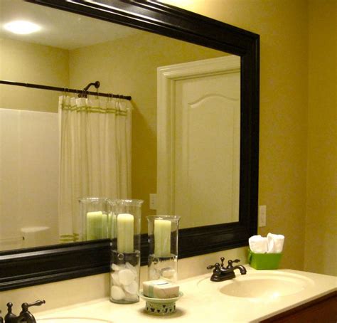 Easy weekend project for framing your bathroom mirror ..... So doing ...