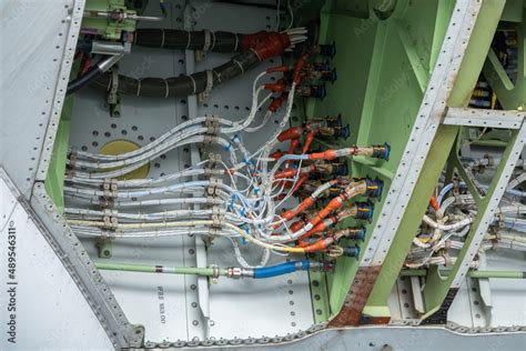 Electrical wiring system of an aircraft or an engine during maintenance. Stock Photo | Adobe Stock