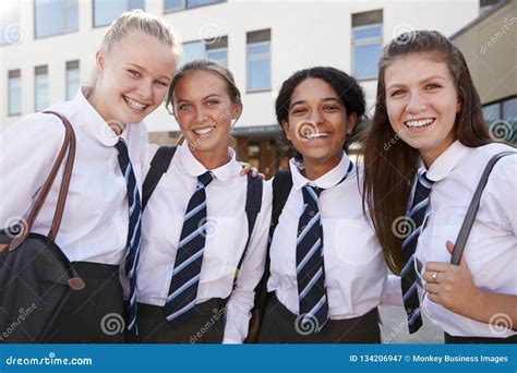 Portrait of Smiling Female High School Students Wearing Uniform Outside ...