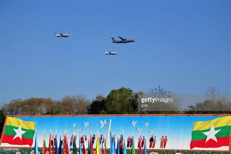 Myanmar Air Force jets perform maneuvers in the sky over a parade ...