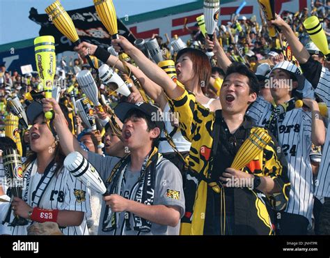 NISHINOMIYA, Japan - Hanshin Tigers fans cheering at Koshien Stadium on ...