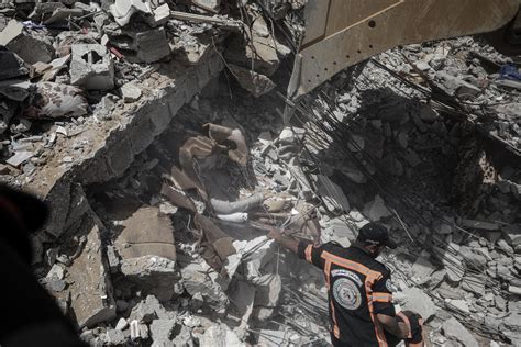 GAZA CITY, GAZA – MAY 16: Search and rescue works continue at debris of a building after ...