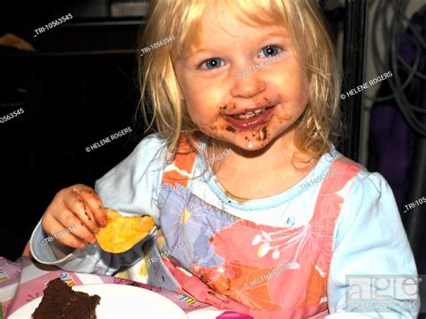 Two Year Old Eating Crisps and Chocolate Birthday Cake, Stock Photo, Picture And Rights Managed ...