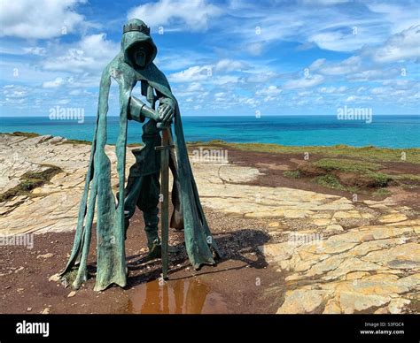 Tintagel Castle - Statue of King Arthur stood on a craggy rock ...